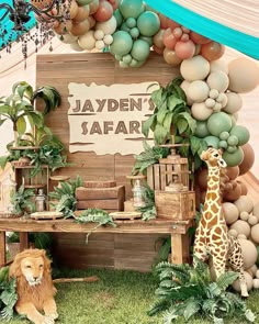 a safari themed birthday party with balloons and decorations