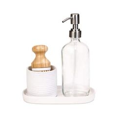 a soap dispenser and bottle on a white tray