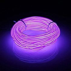 the purple light is glowing up in the dark, and it looks like an electric wire