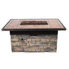 an outdoor fire pit is shown with the lid open to show it's stone design