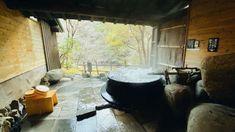 an outdoor hot tub in the middle of a room