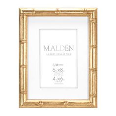 a golden frame with the name maiden on it and measurements for each item in front