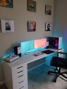 a computer desk with two monitors and a keyboard