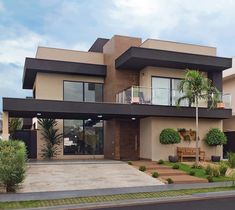 a large house with two balconies on the second floor