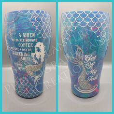 two blue vases with mermaid designs on them