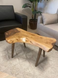 a wooden bench sitting on top of a carpeted floor