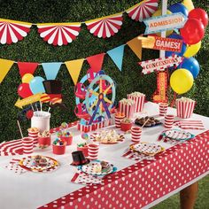 a carnival themed birthday party with red, white and blue decorations on a table cloth