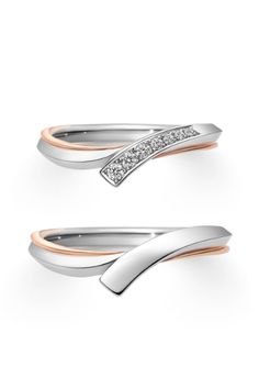 two silver and rose gold rings with diamonds on the top, one is shaped like a wave