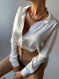 The Rina Satin Blouse is perfect for all occasions. Constructed of a silky satin, it is soft and comfortable yet lays just right around our curves. The buttons match the blouse throughout for a clean look. Available in White, Black, Chocolate, Petal Purple and Pink Roses. White Satin Blouse, Satin Bluse, Black Chocolate, Womens Blouses, Satin Blouse, White Satin, Pink Roses, Womens Clothing Tops, Work Outfit