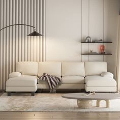 a living room with a white couch and coffee table in front of a striped wall