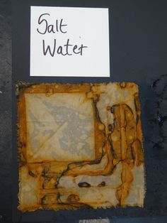 a piece of paper that has some sort of rusted material on it with the words salt water written on it