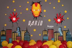 balloons are in front of a wall with the name david and iron man on it