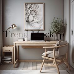 a desk with a laptop on it next to a chair