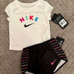 Adorable Bright & Colorful Nike Dri-Fit Outfit! Brand New, Tags Attached. Size: 2t Fast Shipping! (I Ship Daily, Except For Sundays And Holidays) Check Out My Other Listings For More Amazing Finds. I Am Always Happy To Bundle So You Can Save $$. If You Are Interested In Bundling On Multiple Items, Please Make Sure To Message Me Before Purchasing So I Can Set Up A Custom Listing For You. Comes From A Pet & Smoke Free Home. Thanks For Shopping & Stopping By!! Sporty White Sets With Graphic Print, Sporty White Graphic Print Sets, Playful Multicolor Sports Top, Playful Nike Tops For Playtime, Nike Playful Tops, White Graphic Print Sets For Playtime, Nike White Playtime Sets, Playful White Nike T-shirt, Nike White Short Sleeve Sets