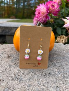 These charming Crochet Pink Strawberry Earrings are a perfect festive accessory or thoughtful gift for her! Expertly handcrafted using intricate microcrochet techniques, these dangle earrings feature delicate donut designs that add a playful, unique touch. Each pair is crafted with love and care, using high-quality materials and finished with 14k gold-plated hooks for a touch of elegance. Lightweight and comfortable to wear, they make a standout piece of handmade jewelry that's perfect for the holiday season or year-round fun. Whether you're treating yourself or surprising a loved one, these kiwi earrings are a whimsical, stylish addition to any collection! Features: Handmade with love using microcrochet techniques 14k gold-plated hooks for a luxurious touch Lightweight and comfortable for Handmade Dangle Earrings As Gift, Handmade Dainty Beaded Drop Earrings, Handmade Adjustable Dainty Earrings, Cute Handmade Drop Earrings, Cute Handmade Drop Flower Earrings, Handmade Cute Flower Drop Earrings, Cute Beaded Earrings For Gift, Pink Crochet Dangle Jewelry, Cute Beaded Earrings For Gifts