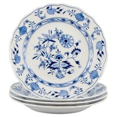 three blue and white plates stacked on top of each other