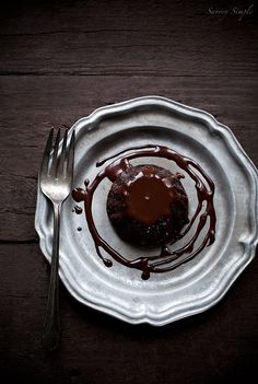 a white plate topped with a chocolate dessert