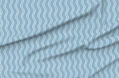 a blue fabric with wavy lines on it