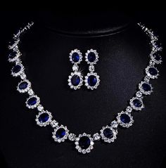 Channel timeless elegance with this Princess Diana-inspired Sapphire Necklace and Ring Set, part of our exquisite India Diamond Jewelry collection. The deep blue allure of the sapphire necklace perfectly complements the brilliance of American Diamonds in this bridal wedding set. Embrace sophistication and regal charm with this captivating ensemble. *𝐏𝐑𝐎𝐃𝐔𝐂𝐓 𝐃𝐄𝐓𝐀𝐈𝐋* * Material: Brass * Plating: White Rhodium Plated * Stone: AAA Quality CZ Diamond & Sapphire. *𝐃𝐈𝐌𝐄𝐍𝐒𝐈𝐎𝐍𝐒* *    Necklace- Weight: 32 gm, Length: 8.7 Inches, Drop Length: 4.5 Inches, Width: 0.7 Inches *    Earrings- Weight: 6 gm Each, Length: 1.65 Inches, Width: 0.65 Inches *𝐒𝐇𝐈𝐏𝐏𝐈𝐍𝐆 𝐏𝐎𝐋𝐈𝐂𝐘* * Shipping: worldwide from India. * Free shipping: All our products have a free standard shipping polic Big Diamond Necklace, Big Diamonds Necklace, Blue Diamond Necklace, Necklace Blue Stone, Necklace Princess, Sapphire Diamond Necklace, Diamond Necklace Wedding, Necklace Sapphire, Blue Stone Necklace