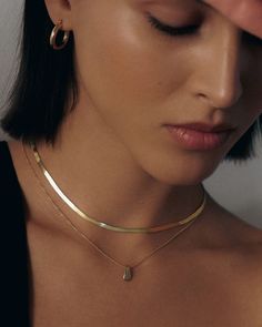 Kinn designs solid gold modern heirlooms, made to last a lifetime. Elegant and sophisticated, herringbone chains date back to Ancient Egypt. Often referred to as liquid gold, this chain will elevate any look. Available in two lengths Fall Rings, Oval Locket, Herringbone Chain, Liquid Gold, Tennis Necklace, Pant Suit, Teardrop Necklace, Broken Chain, Huggie Earrings