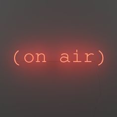 a neon sign that reads on air