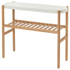 a wooden shelf with a white top on it