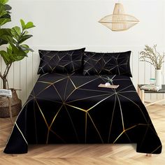 black and gold bedding with geometric shapes