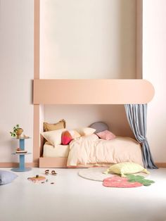 a bedroom with a pink bed and white walls