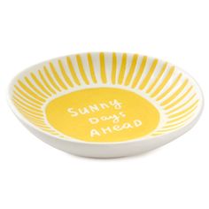 a yellow and white bowl that says sunny day ahead