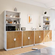 a living room filled with lots of furniture and white shelves on top of each other