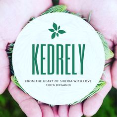 two hands holding a round paper label with the words kedrely written on it