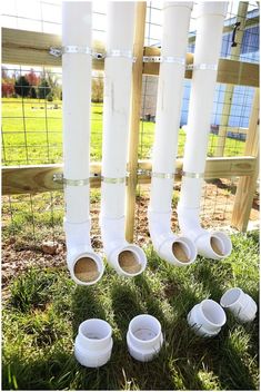 several white plastic cups sitting in the grass