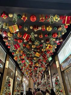 Christmas Decor Ideas Store, Presents Hanging From Ceiling, Resturant Ideas For Christmas, Santas Workshop Decor, Pub Christmas Decor, Macys Christmas Window Display, Holiday Restaurant Decor, Christmas Pub Decorations, Pub Christmas Decorations