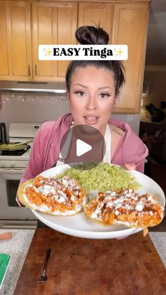 a woman holding a plate full of food in her hands with the caption easy tinga