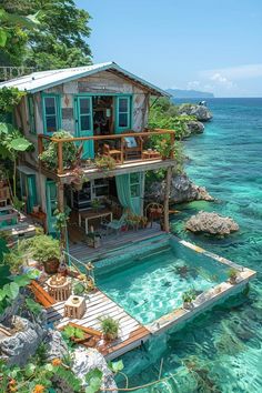 a house on the water with plants growing out of it