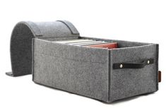 a gray felt storage box with two compartments and a file folder in the bottom compartment