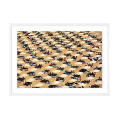 an image of people sitting under umbrellas on the beach