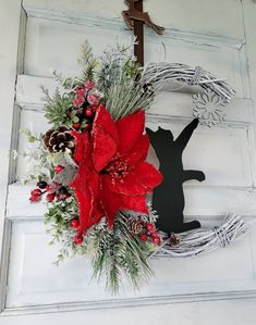 a christmas wreath hanging on the front door