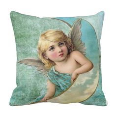 a pillow with an angel sitting on top of it