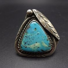 "VINTAGE NAVAJO RING DESCRIPTION: This spectacular ring features a huge triangular cabochon of brilliant blue turquoise. The gemstone is secure in smooth bezel, on a foundation of heavy gauge vintage sterling silver. This ring will be a treasured addition to your collection of fine vintage Native American jewelry. MEASUREMENTS: Ring face measures 1 1/2\" x 1 1/2\" Cabochon measures 23mm x 23mm RING SIZE: 10 3/4 WEIGHT: 17.7 grams SIGNED: no STERLING: unmarked, verified sterling silver yes, stamp Vintage Turquoise Ring With Polished Finish, Collectible Vintage Turquoise Ring With Polished Finish, Turquoise Jewelry Rings, Italian Gold Jewelry, Mirror Jewelry Armoire, Silver Turquoise Ring, Vintage Native American Jewelry, Turquoise Ring Silver, Large Jewelry