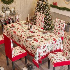 a dining room table covered with christmas decorations