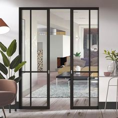 an open living room and dining area with sliding glass doors