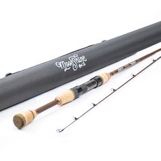 a fishing rod with two rods attached to it and an empty case on the side