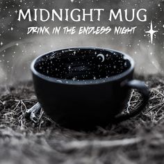 a black coffee cup sitting on top of a pile of hay with the words midnight mug drink in the endless night