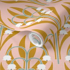 a pink and gold wallpaper with white flowers on it