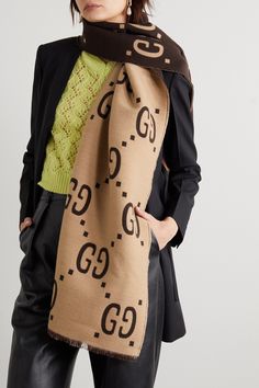 Gucci's scarf is woven from a sumptuous blend of wool and silk so it feels really soft and smooth against your skin. It's patterned with an exaggerated version of the house's 'GG' emblem in earthy brown and beige hues, which will go with so many coats and knits. Spritz it with cedar spray occasionally to deter moths. Luxury Gucci Silk Scarves, Luxury Beige Scarf For Fall, Luxury Gucci Scarves For Fall, Elegant Gucci Silk Scarves, Designer Gucci Silk Scarves, Elegant Gucci Silk Scarf, Designer Gucci Scarves For Winter, Luxury Brown Scarves For Winter, Designer Gucci Winter Scarves