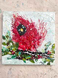 a painting of a red bird on a branch with snow falling down it's face