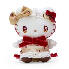 a hello kitty stuffed animal with a bow on it's head, wearing a dress