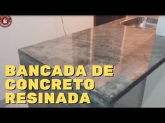 a kitchen counter with the words bancada de concreto resinada