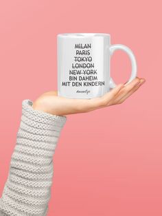 a woman's hand holding a white coffee mug with the quote general lora on it